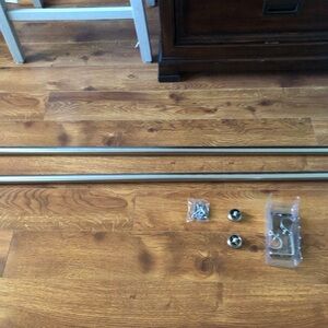 Set of two curtain rod extenders with hardware